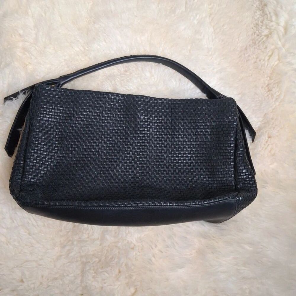 Cole Haan woven black leather shoulder bag.